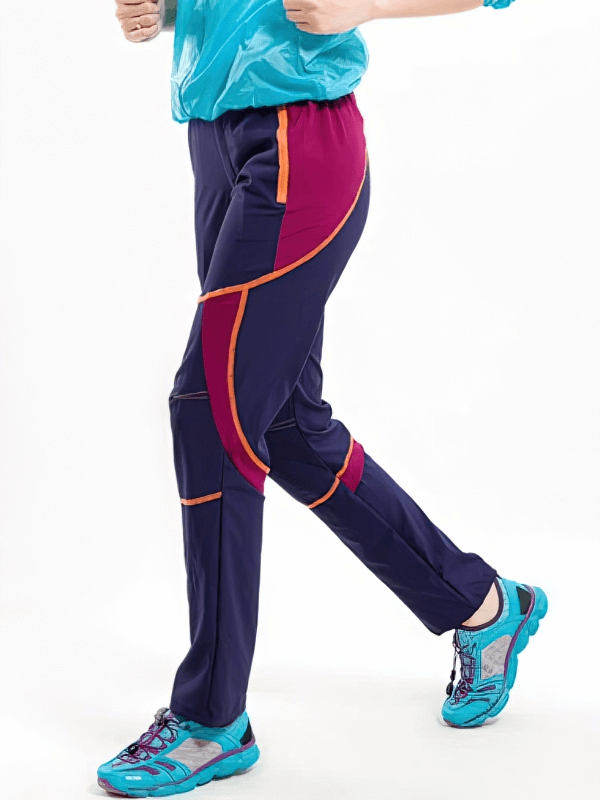 Woman wearing sports breathable quick-drying hiking pants, SF0240, in navy and pink, ideal for outdoor adventures.